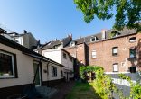Düsseldorf-Hassels. Ein- oder Mehrfamilienhaus plus Nutzfläche und viel Potenzial. - Rückwärtige Ansicht